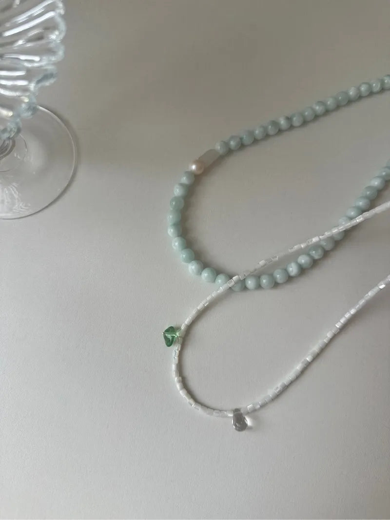 Elegant Pearl Bead Necklace with Distinctive Green Charm - Fashionable Accessory for All Occasions