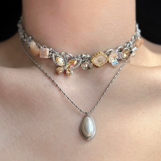 Vintage Elegant Silver Color Butterfly Pendant Necklace with Colorful Cubic Zirconia, complemented by a silver mother-of-pearl pendant