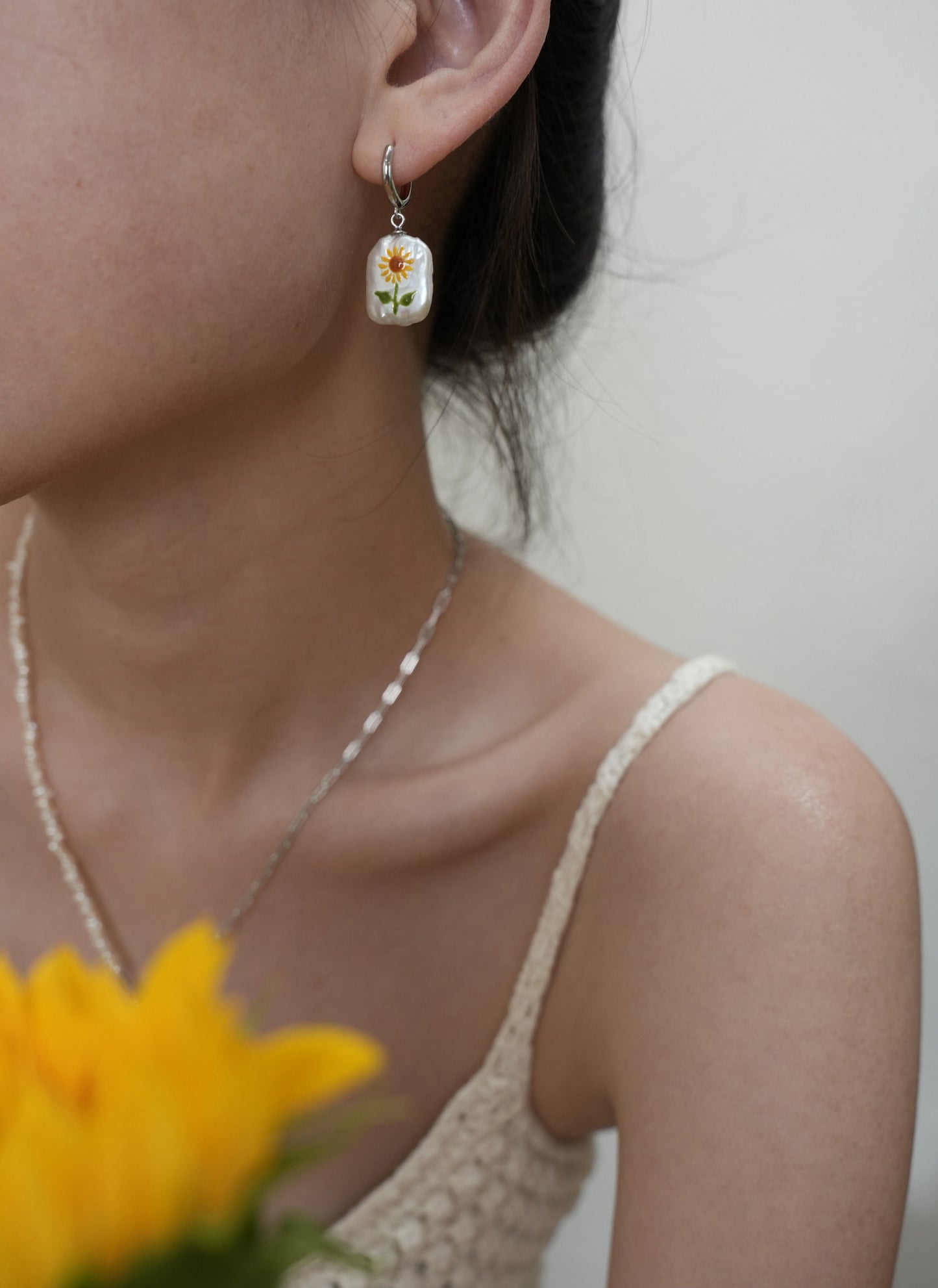 Sunflower Pearl Pendant, featuring pearls set in 18K gold-plated and terling silver chain, complemented by Sunflower Pearl Earrings.