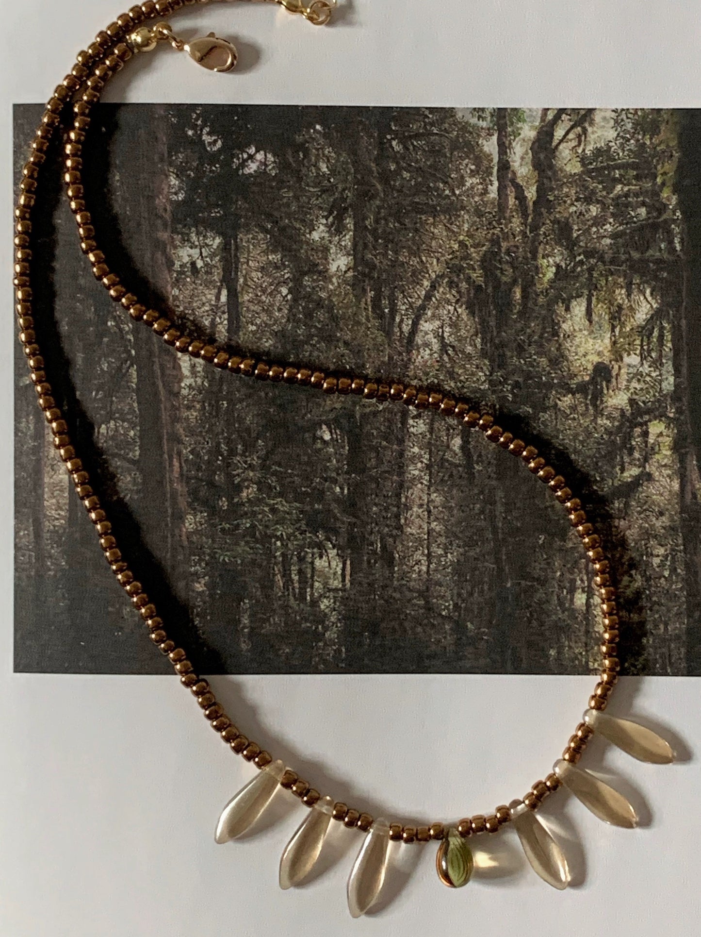 Vintage court-style necklace featuring Czech beads paired with natural stone transparent teardrop pendants.