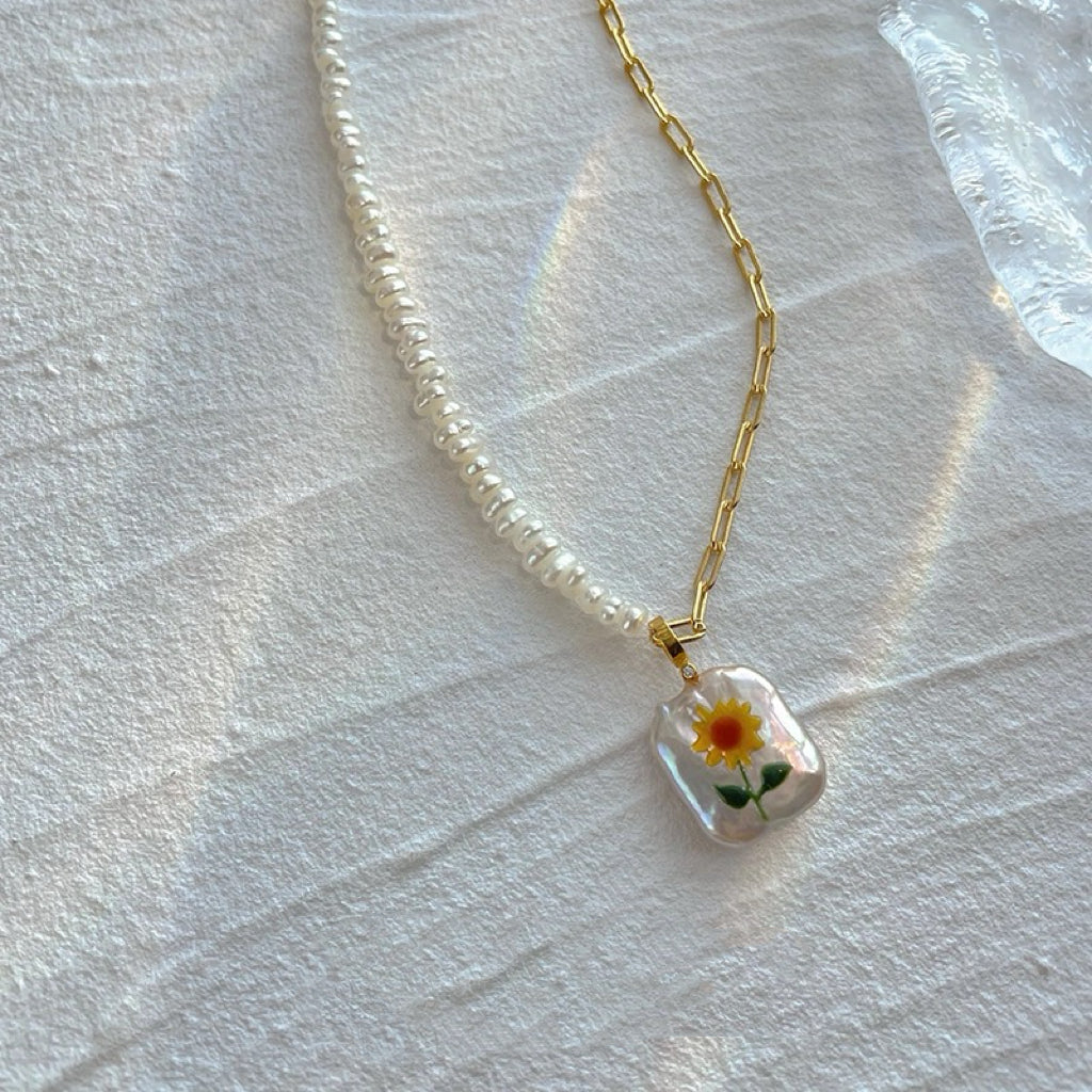 Sunflower Pearl Pendant, featuring pearls set in 18K gold-plated and terling silver chain, complemented by Sunflower Pearl Earrings.