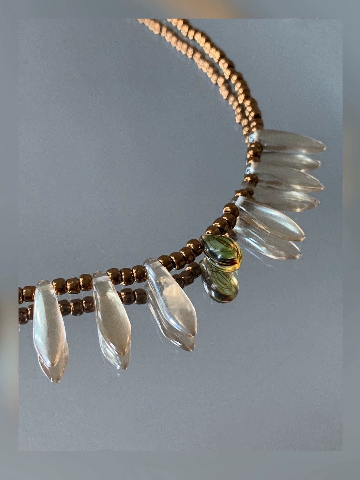 Vintage court-style necklace featuring Czech beads paired with natural stone transparent teardrop pendants.