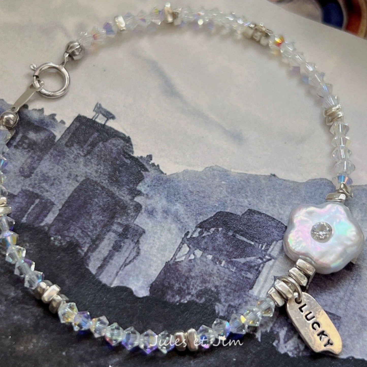Charming Mother-of-Pearl Floral Charm Bracelet with Iridescent Beads and Pink Gemstone Accents
