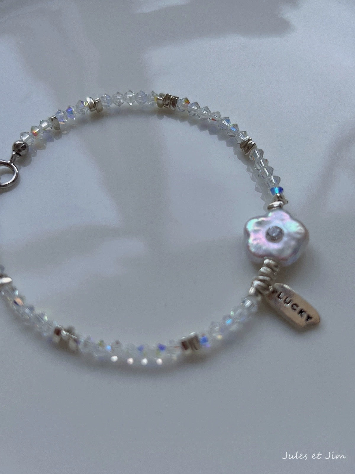Charming Mother-of-Pearl Floral Charm Bracelet with Iridescent Beads and Pink Gemstone Accents