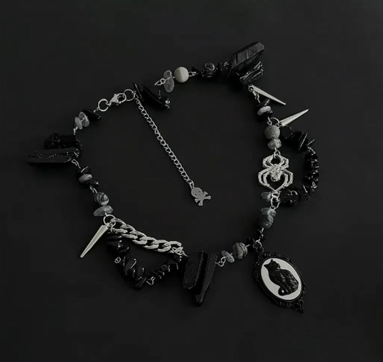 Cyberpunk black cat pendant silver choker, decorated with obsidian, accented with spider and spike elements, featuring a unique design.