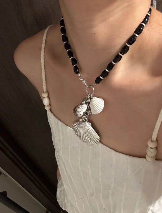 Handcrafted,silver shell pendant necklace with black beaded necklace, adorned with shell and conch decorations,unique ocean style.nice gift.