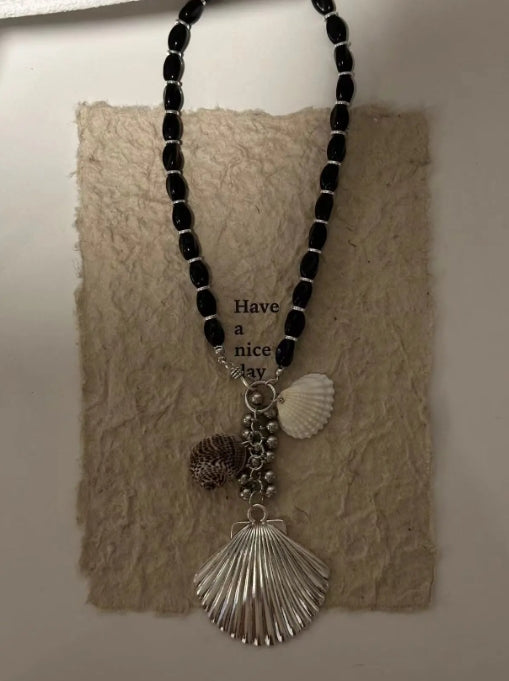 Handcrafted,silver shell pendant necklace with black beaded necklace, adorned with shell and conch decorations,unique ocean style.nice gift.