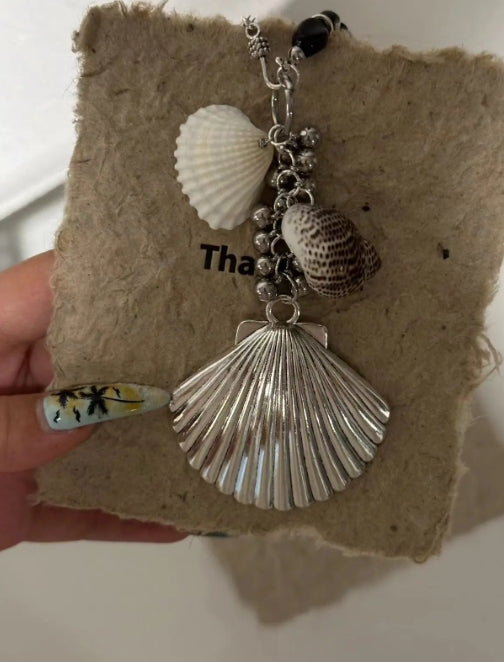 Handcrafted,silver shell pendant necklace with black beaded necklace, adorned with shell and conch decorations,unique ocean style.nice gift.