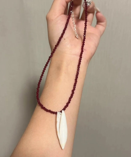 Handcrafted conch pendant with deep red beads necklace,natural conch shells, featuring a simple and exquisite design. It's a perfect gift.