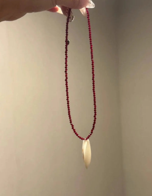 Handcrafted conch pendant with deep red beads necklace,natural conch shells, featuring a simple and exquisite design. It's a perfect gift.