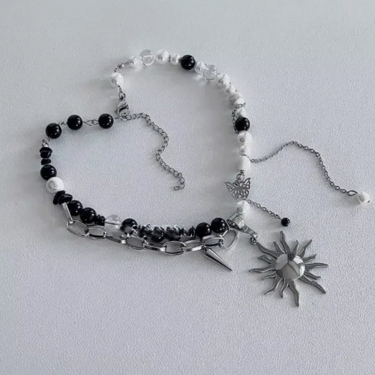 Cyberpunk-inspired sun pendant necklace, accented with obsidian and pearls on a double-layer chain, Y2K choker. It's a perfect gift