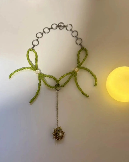 Handcrafted conch pendant necklace with green beaded bow accents, designed with a minimalist approach, Y2Kchoker,It's a perfect gift