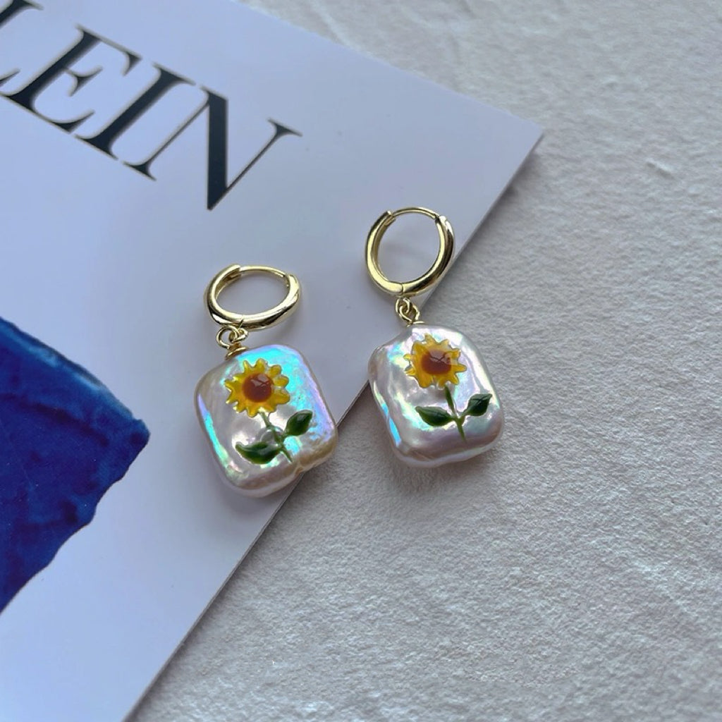 Sunflower Pearl Pendant, featuring pearls set in 18K gold-plated and terling silver chain, complemented by Sunflower Pearl Earrings.