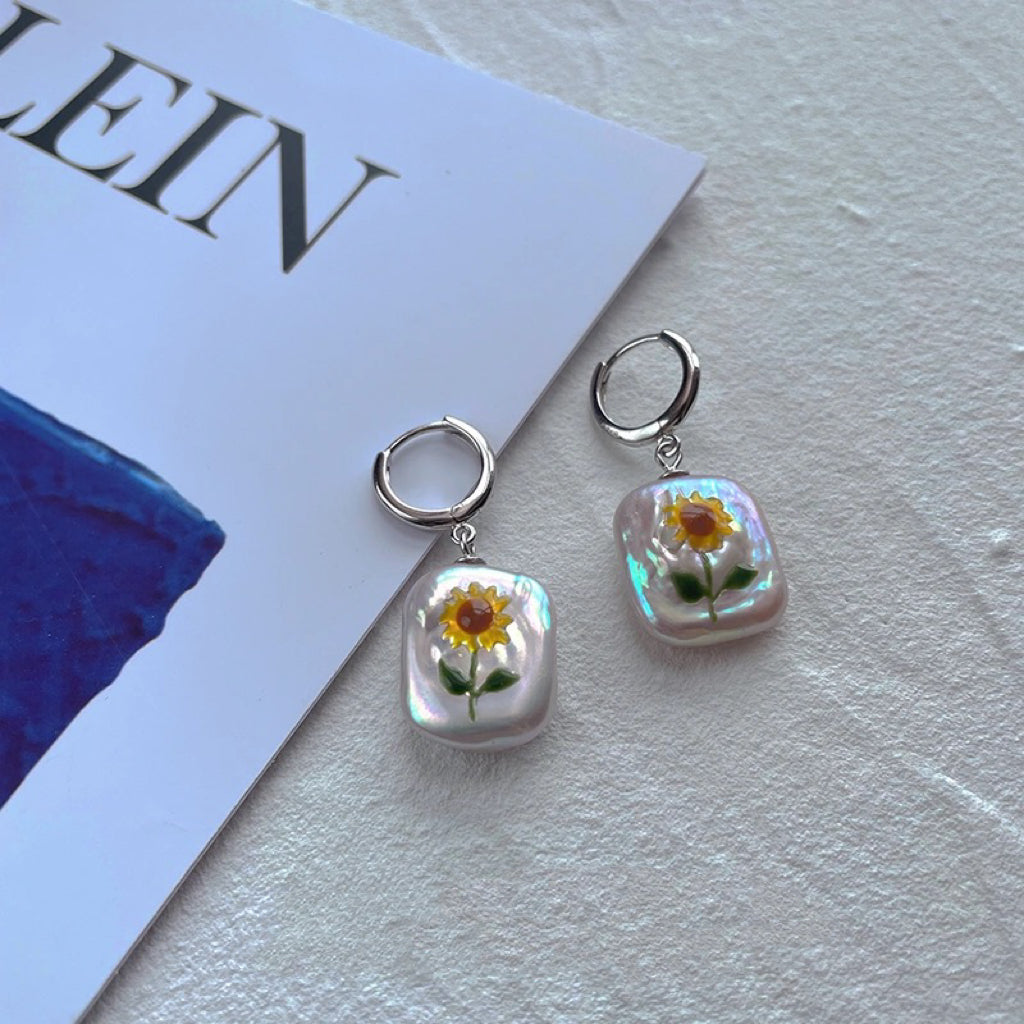 Sunflower Pearl Pendant, featuring pearls set in 18K gold-plated and terling silver chain, complemented by Sunflower Pearl Earrings.