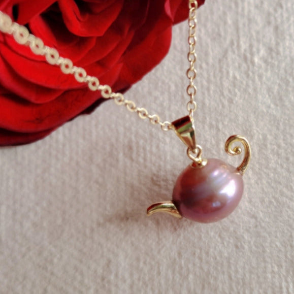A French-style, vintage-inspired, naturally Baroque pearl teapot pendant necklace