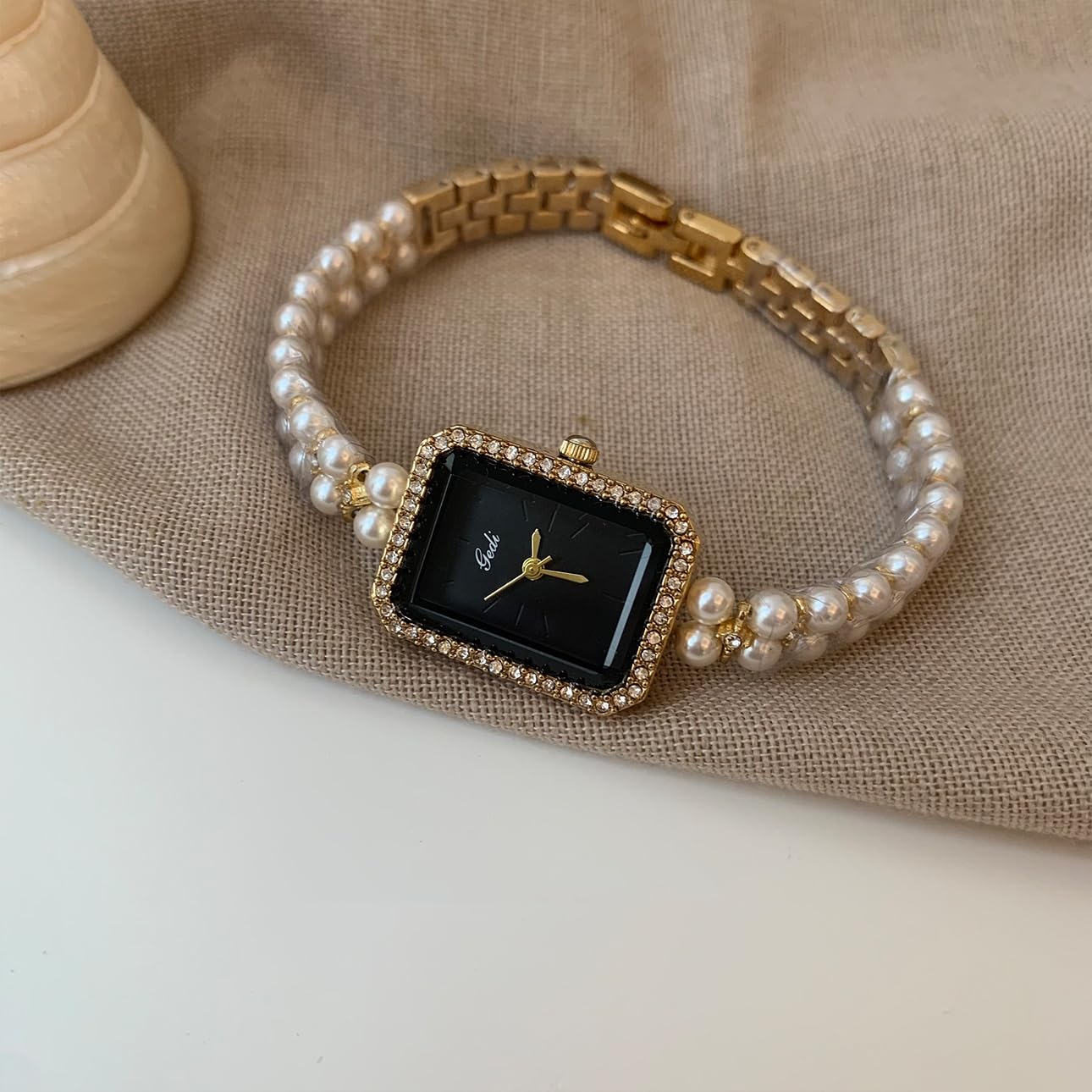 Pearl Strap Black Gold Watch: Square Dial for a Unique, Stylish Women's Timepiece with Sophisticated Appeal