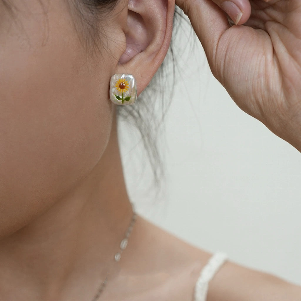 Sunflower Pearl Pendant, featuring pearls set in 18K gold-plated and terling silver chain, complemented by Sunflower Pearl Earrings.