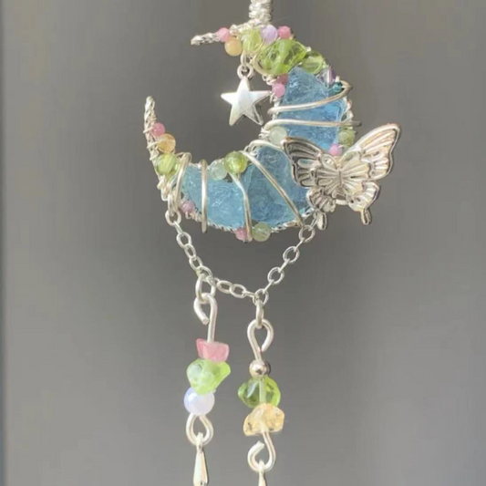 Moon-shaped blue crystal pendant necklace, adorned with butterfly and multicolored floral crystal elements, silver chain, unique handmade crystal necklace.