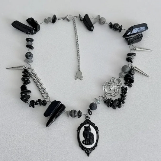 Cyberpunk black cat pendant silver choker, decorated with obsidian,  accented with spider and spike elements, featuring a unique design.