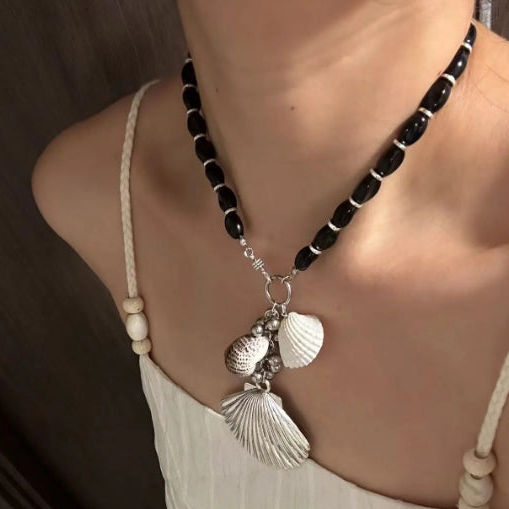 Handcrafted,silver shell pendant necklace with black beaded necklace, adorned with shell and conch decorations,unique ocean style.nice gift.