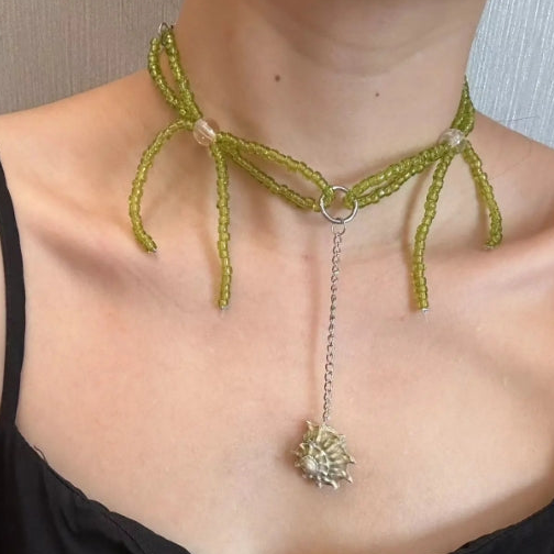 Handcrafted conch pendant necklace with green beaded bow accents, designed with a minimalist approach, Y2Kchoker,It's a perfect gift