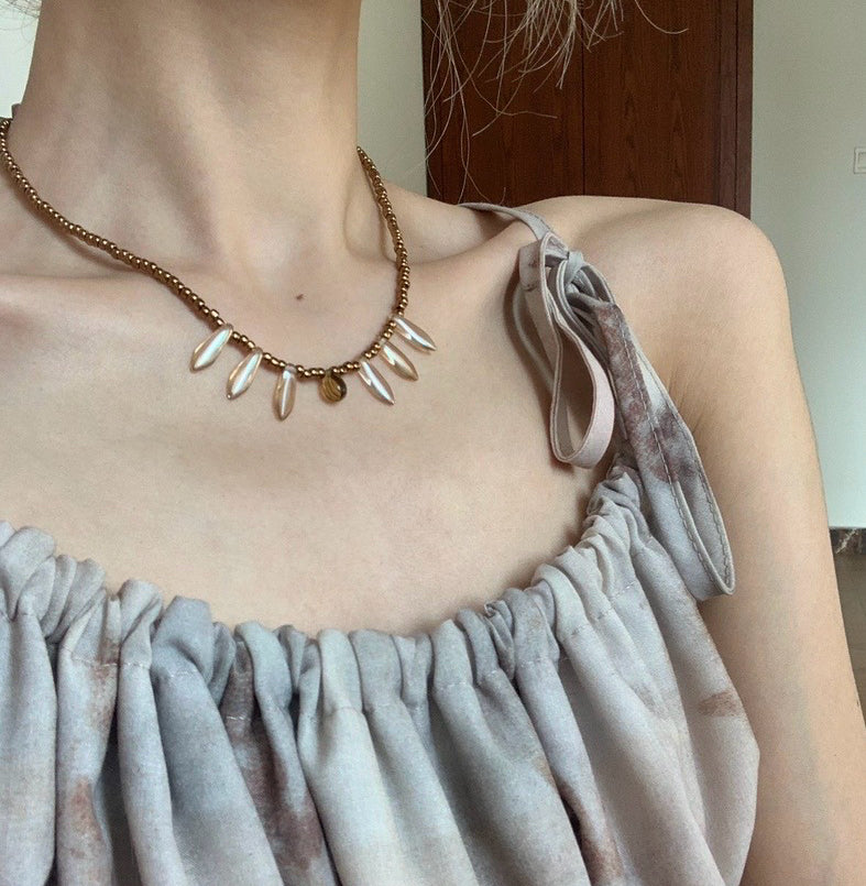 Vintage court-style necklace featuring Czech beads paired with natural stone transparent teardrop pendants.