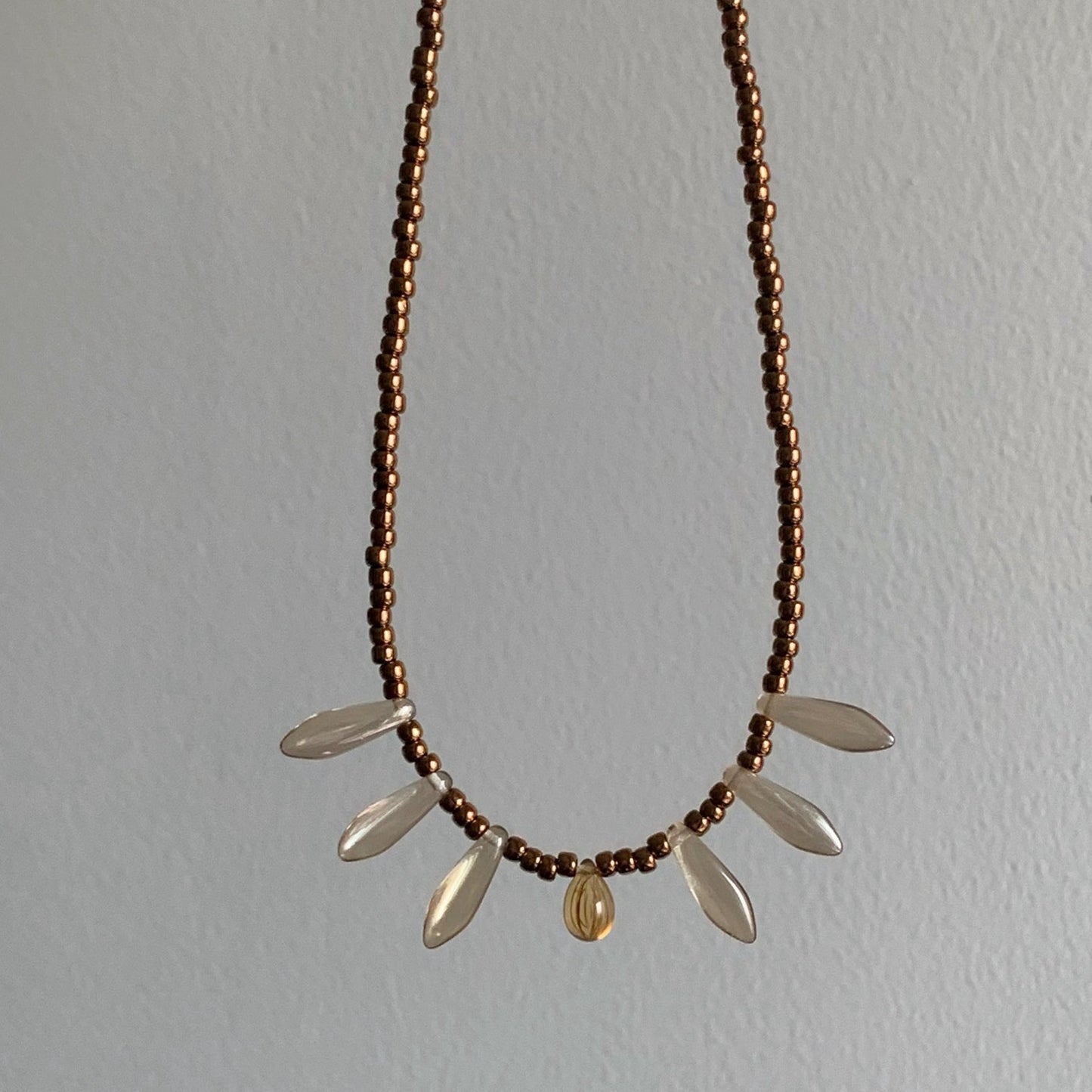 Vintage court-style necklace featuring Czech beads paired with natural stone transparent teardrop pendants.