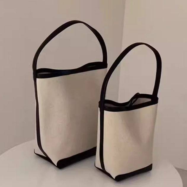 Women's 2024 new trend in handbags, trendy this year with a sense of luxury, black and white niche canvas tote bag, large capacity bucket crossbody bag