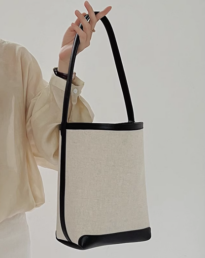 Women's 2024 new trend in handbags, trendy this year with a sense of luxury, black and white niche canvas tote bag, large capacity bucket crossbody bag