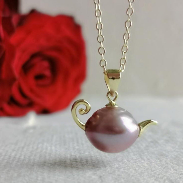 A French-style, vintage-inspired, naturally Baroque pearl teapot pendant necklace