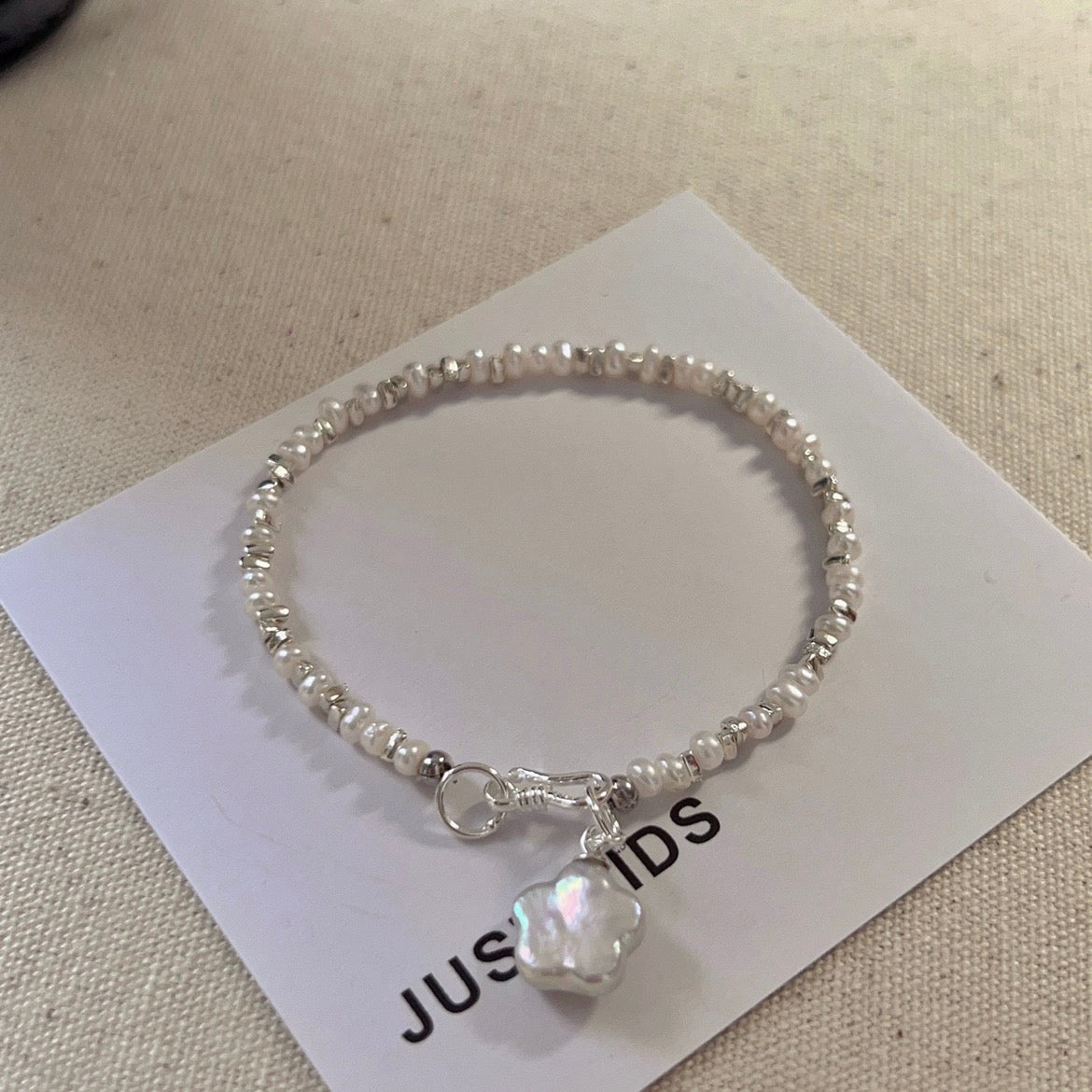 Delicate Sterling Silver Natural Pearl Bracelet with Shimmering Charm - Timeless Handcrafted Accessory