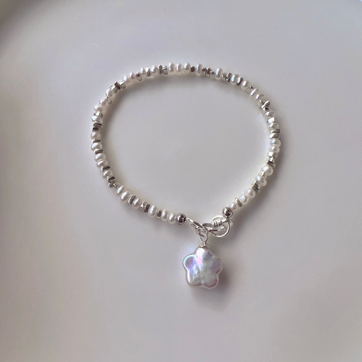 Delicate Sterling Silver Natural Pearl Bracelet with Shimmering Charm - Timeless Handcrafted Accessory