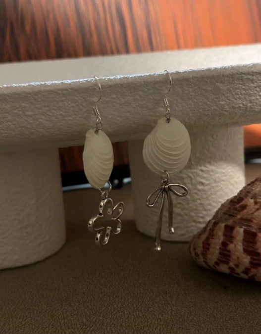 Handcrafted white shell earrings featuring floral and bow pendants, S925 silver，embodying a unique and niche style, a perfect gift for her.