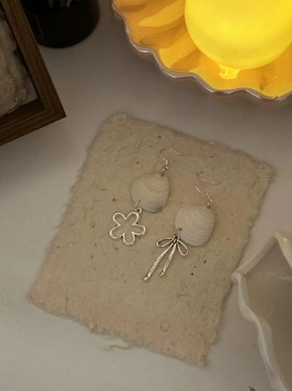 Handcrafted white shell earrings featuring floral and bow pendants, S925 silver，embodying a unique and niche style, a perfect gift for her.