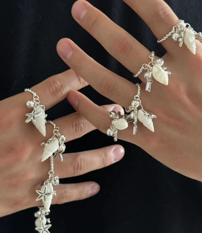 Handcrafted silver ring with a conch and starfish pendant, made from natural conch shells, unique and niche design. a perfect gift for her.