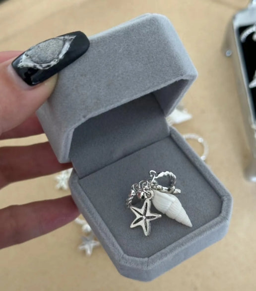 Handcrafted silver ring with a conch and starfish pendant, made from natural conch shells, unique and niche design. a perfect gift for her.