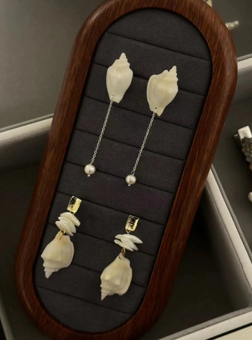 Handcrafted from natural white conch shells, accented with pearls,s925 silver posts, showcasing a unique and minimalist design,perfect gift