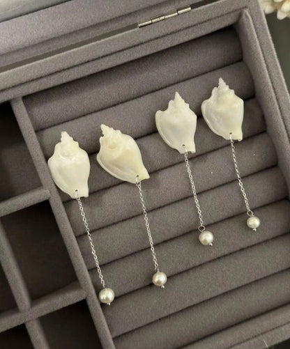 Handcrafted from natural white conch shells, accented with pearls,s925 silver posts, showcasing a unique and minimalist design,perfect gift