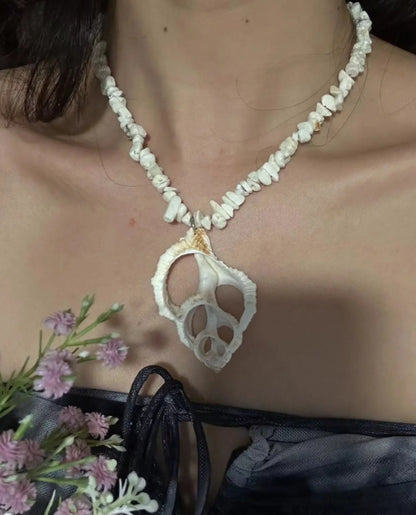 Handcrafted white conch pendant necklace, featuring an irregularly shaped conch, showcasing a unique marine element design,a perfect gift