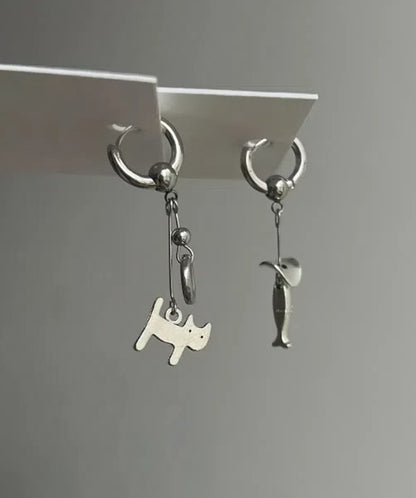 Handcrafted pair of earrings featuring kitten and fish pendants,designed with silver-tone metal, playful and fun design,a perfect gift.