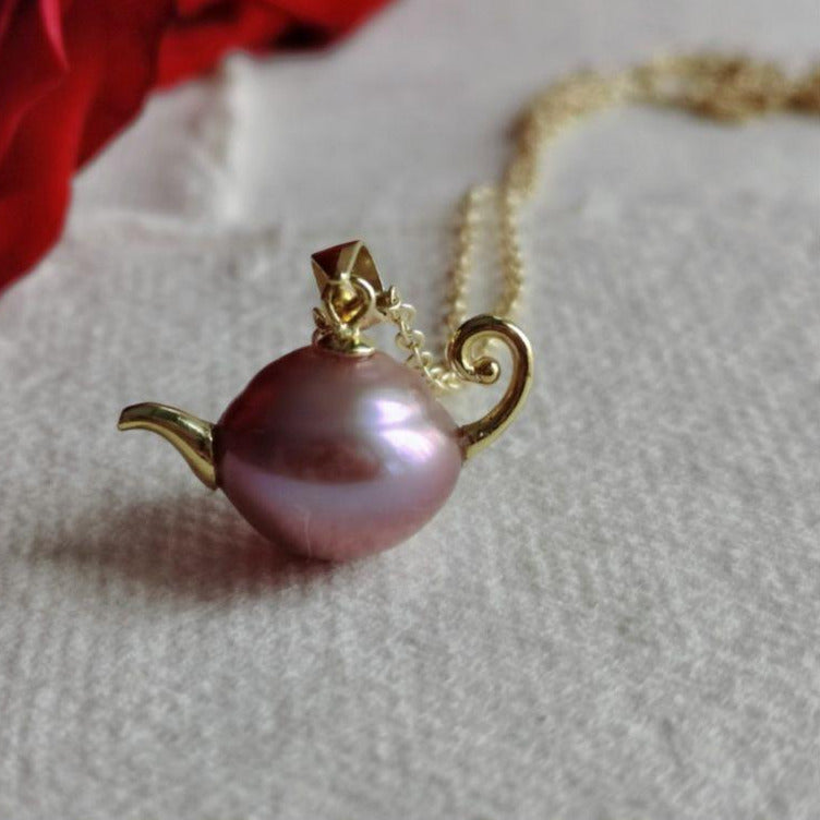 A French-style, vintage-inspired, naturally Baroque pearl teapot pendant necklace