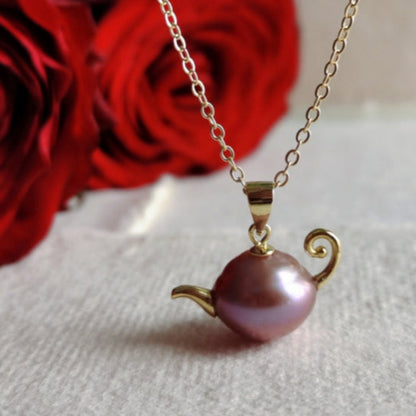 A French-style, vintage-inspired, naturally Baroque pearl teapot pendant necklace