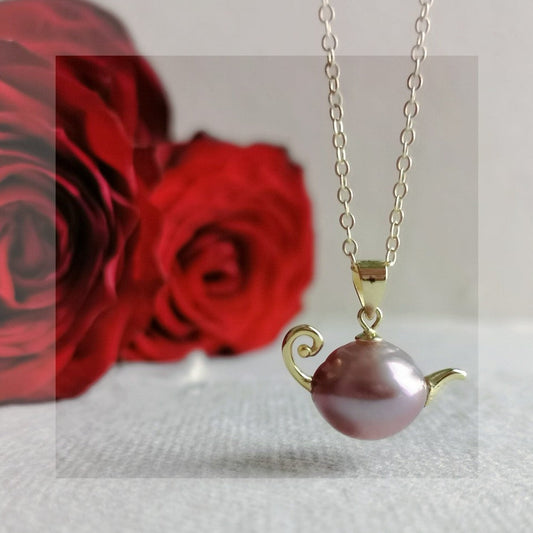 A French-style, vintage-inspired, naturally Baroque pearl teapot pendant necklace
