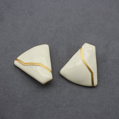 Sleek white enamel geometric earrings with gold zigzag pattern, modern electroplated geometric jewelry, chic accessory for everyday elegance and special occasions.