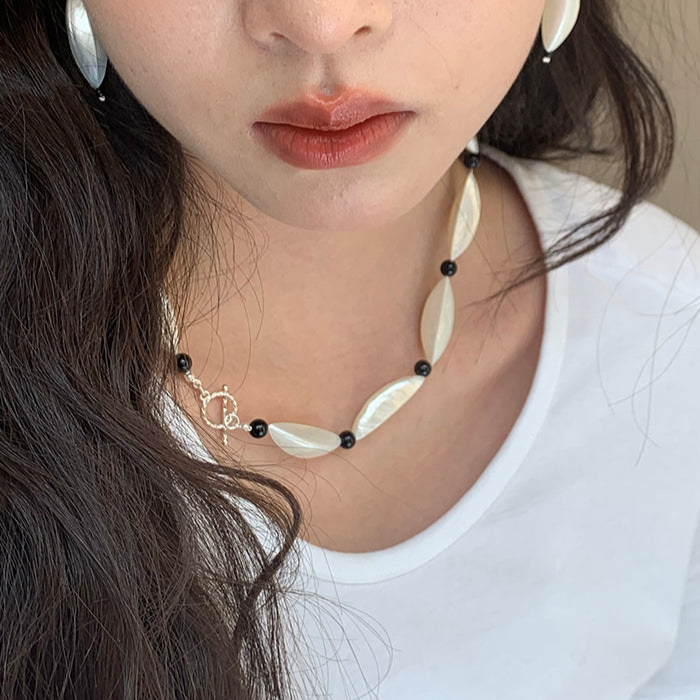 Crescent Moon White and Black Beaded Clavicle Chain Necklace with Statement Design
