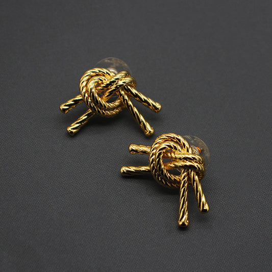 Vintage-modern 18K gold-plated rope knot stud earrings, elegant and stylish, versatile classic accessory for everyday wear.