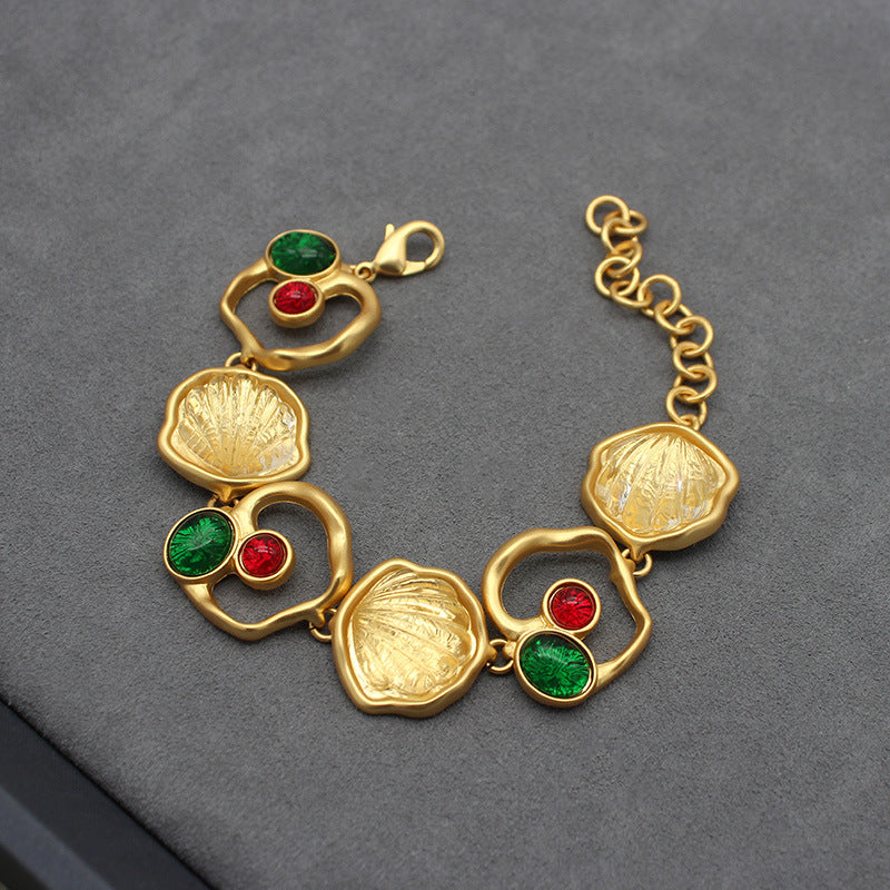 Handcrafted Jelly Glass-Look Gold-Plated Bracelet and Stud Earrings Set - Embossed Floral Design with Red & Green Gemstone Accents, Elegant Accessory for Day to Evening Glamour