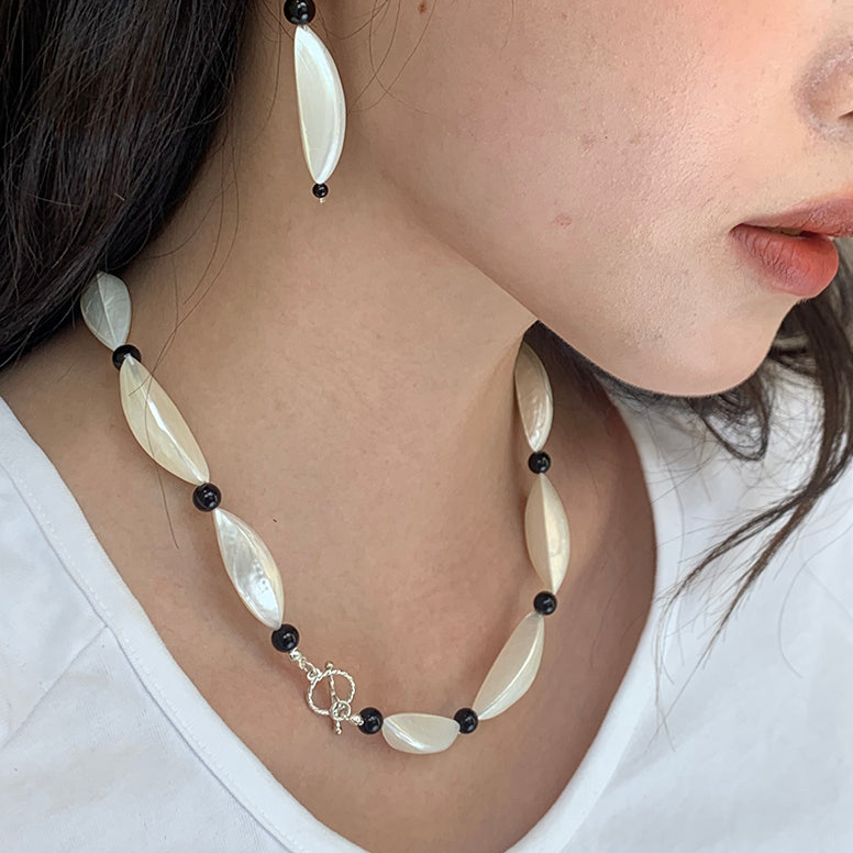 Crescent Moon White and Black Beaded Clavicle Chain Necklace with Statement Design