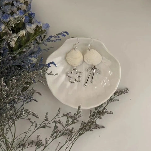 Handcrafted white shell earrings featuring floral and bow pendants, S925 silver，embodying a unique and niche style, a perfect gift for her.
