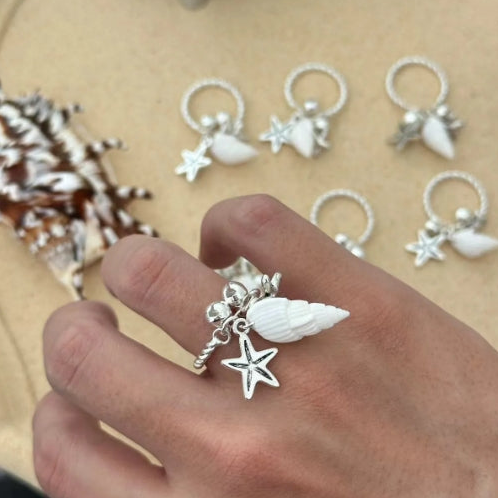 Handcrafted silver ring with a conch and starfish pendant, made from natural conch shells, unique and niche design. a perfect gift for her.